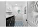 Laundry room featuring patterned floors, new machines, sink, and countertop at 108 Vescova Ln, Morrisville, NC 27560
