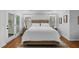 Comfortable main bedroom with neutral tones, wood floors, and natural light at 108 Vescova Ln, Morrisville, NC 27560