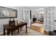 Office with a work desk, an area rug, and an open entry into the dining area at 108 Vescova Ln, Morrisville, NC 27560