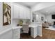 A dedicated office space with white built-in cabinets, marble countertops, and neutral decor at 108 Vescova Ln, Morrisville, NC 27560