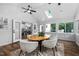 Bright sunroom with vaulted ceilings, wood floors, and access to the kitchen at 108 Vescova Ln, Morrisville, NC 27560
