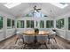 Bright sunroom featuring large windows, a round table, and comfortable seating for six at 108 Vescova Ln, Morrisville, NC 27560