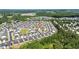 Aerial view of a residential neighborhood, surrounded by lush greenery and mature trees at 1085 Lobdale Ct, Burlington, NC 27215