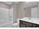 Bathroom featuring a bathtub-shower combo and vanity with dark wood cabinets at 1085 Lobdale Ct, Burlington, NC 27215