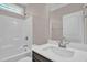 Bathroom featuring a tub-shower combo and dark wood vanity at 1085 Lobdale Ct, Burlington, NC 27215