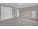 Spacious bedroom with carpet floors, featuring closet and access doors at 1085 Lobdale Ct, Burlington, NC 27215