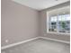 Bedroom featuring neutral walls, a window, and gray carpet at 1085 Lobdale Ct, Burlington, NC 27215