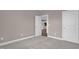 Neutral bedroom with an open door to kitchen and a double-doored closet to the right at 1085 Lobdale Ct, Burlington, NC 27215