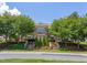 A stately home with stone facade, manicured landscaping and mature shade trees at 1085 Lobdale Ct, Burlington, NC 27215