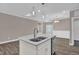 Kitchen island features granite countertops, stainless steel dishwasher, and double sinks at 1085 Lobdale Ct, Burlington, NC 27215