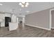 Open-concept living room with fireplace, large windows, and hardwood floors at 1085 Lobdale Ct, Burlington, NC 27215