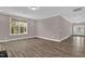 Cozy living room features large windows and neutral paint, creating a relaxing atmosphere at 1085 Lobdale Ct, Burlington, NC 27215