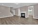 Bright living room with fireplace and a staircase offers a welcoming space at 1085 Lobdale Ct, Burlington, NC 27215