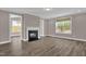Spacious living room with fireplace and large windows offers plenty of natural light at 1085 Lobdale Ct, Burlington, NC 27215