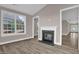 Cozy living room features a fireplace and large windows that provide natural light at 1085 Lobdale Ct, Burlington, NC 27215