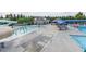 A large community pool with slides, splashpad and lounge chairs under shaded canopies at 1085 Lobdale Ct, Burlington, NC 27215