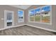 Bright sunroom features large windows and a glass door, perfect for enjoying the view at 1085 Lobdale Ct, Burlington, NC 27215