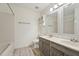 Bathroom with double sink vanity, neutral walls, and tiled bath at 111 Catherwood Pl, Cary, NC 27518