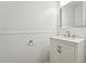 Updated powder room with modern vanity, brushed nickel faucet, and beadboard accents at 111 Catherwood Pl, Cary, NC 27518