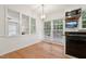 Eat-in kitchen features black appliances, granite counters, tile backsplash, and pendant lighting at 111 Catherwood Pl, Cary, NC 27518