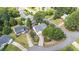 An aerial view displays this home's well manicured lawn with beautiful landscaping in a desirable neighborhood at 1113 Pilton Pl, Raleigh, NC 27604