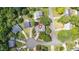 An aerial view showcasing the home's location on a cul-de-sac and the surrounding lush greenery at 1113 Pilton Pl, Raleigh, NC 27604