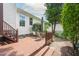 Spacious back deck features outdoor seating, steps, and views of the backyard landscaping at 1113 Pilton Pl, Raleigh, NC 27604