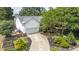A charming two-story home with an attached garage and well-manicured front yard gardens at 1113 Pilton Pl, Raleigh, NC 27604