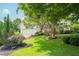 Charming home with a beautifully landscaped yard, mature trees and an attached two-car garage at 1113 Pilton Pl, Raleigh, NC 27604