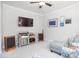 Cozy living room with plush seating, vintage stereo equipment, and curated art displayed on a wall at 1113 Pilton Pl, Raleigh, NC 27604