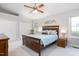 Spacious bedroom features a ceiling fan, neutral walls, and coordinating furniture at 1113 Pilton Pl, Raleigh, NC 27604
