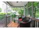 Relaxing screened porch with comfortable seating offering an inviting outdoor space at 1113 Pilton Pl, Raleigh, NC 27604