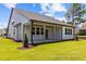 The house has a spacious covered patio, ideal for outdoor enjoyment at 112 Cultivator Ct, Angier, NC 27501