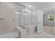 Bathroom featuring a frameless shower, soaking tub, and access to the bedroom at 112 Cultivator Ct, Angier, NC 27501
