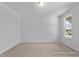 Bright bedroom featuring a large window offering an inviting atmosphere at 112 Cultivator Ct, Angier, NC 27501