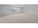 Expansive bonus room filled with natural light showcases ample space for a variety of lifestyle needs at 112 Cultivator Ct, Angier, NC 27501