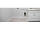 Laundry area with white cabinets, sink, and a space for a washer and dryer at 112 Cultivator Ct, Angier, NC 27501