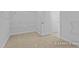 Spacious walk-in closet with wire shelving and neutral carpet, ready to be customized for optimal storage at 112 Cultivator Ct, Angier, NC 27501