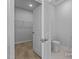 Walk-in closet with an open door, a carpeted floor, and wire shelving for optimal organization at 112 Cultivator Ct, Angier, NC 27501