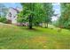 Lush backyard offering a serene and private outdoor space at 112 River Dell Townes Ave, Clayton, NC 27527