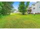 Sprawling backyard with mature trees, offering privacy and a sense of tranquility at 112 River Dell Townes Ave, Clayton, NC 27527