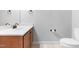 Neutral bathroom features white sink, wood vanity, tile floors, and gray walls at 112 River Dell Townes Ave, Clayton, NC 27527