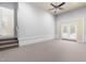 Spacious bonus room with steps to the main level and french doors to the backyard at 112 River Dell Townes Ave, Clayton, NC 27527