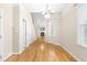 Traditional dining room features hardwood floors, crown molding, and chandelier lighting at 112 River Dell Townes Ave, Clayton, NC 27527