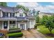 Charming home with stone accents, metal roof, and meticulously maintained landscaping at 112 River Dell Townes Ave, Clayton, NC 27527
