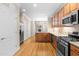 Modern kitchen with granite counters, stainless appliances, and ample storage, open to dining and living areas at 112 River Dell Townes Ave, Clayton, NC 27527