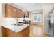Charming kitchen with stainless steel appliances, granite countertops, and hardwood floors at 112 River Dell Townes Ave, Clayton, NC 27527