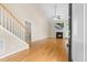 Bright, open living room with hardwood floors, a fireplace, and soaring ceilings provides an inviting space at 112 River Dell Townes Ave, Clayton, NC 27527
