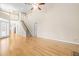 Open-concept living room offering hardwood floors, high ceilings, and plenty of natural light at 112 River Dell Townes Ave, Clayton, NC 27527
