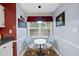 Charming breakfast nook with a round table set by a bright window, perfect for intimate dining at 1200 Collington Dr, Cary, NC 27511